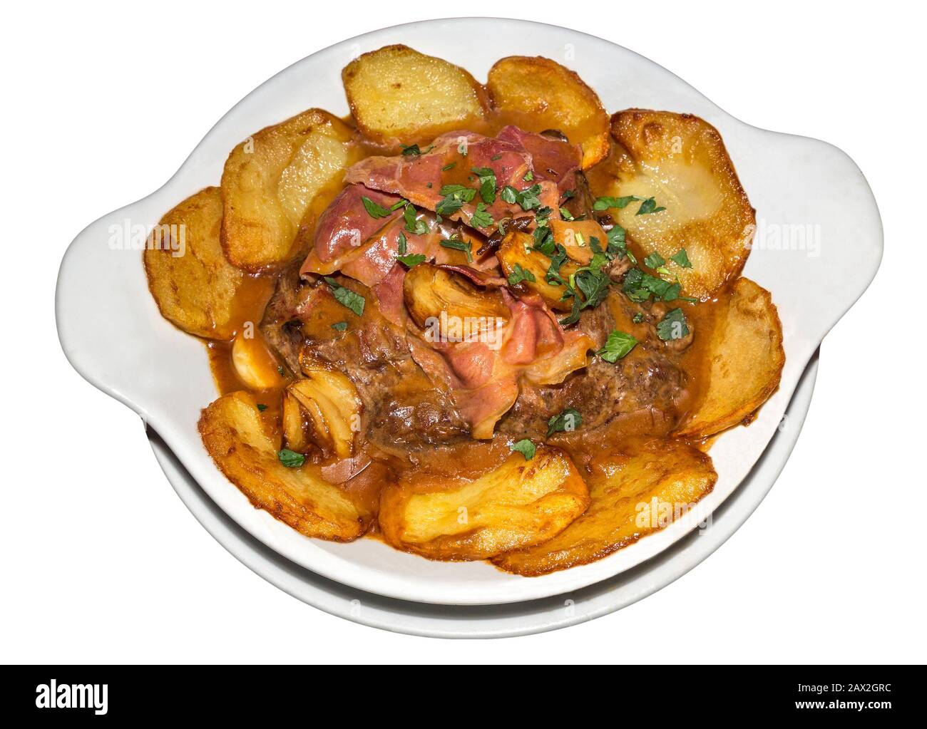 Fillet steak Portuguese style with garlic, bacon and saute potatoes Stock Photo