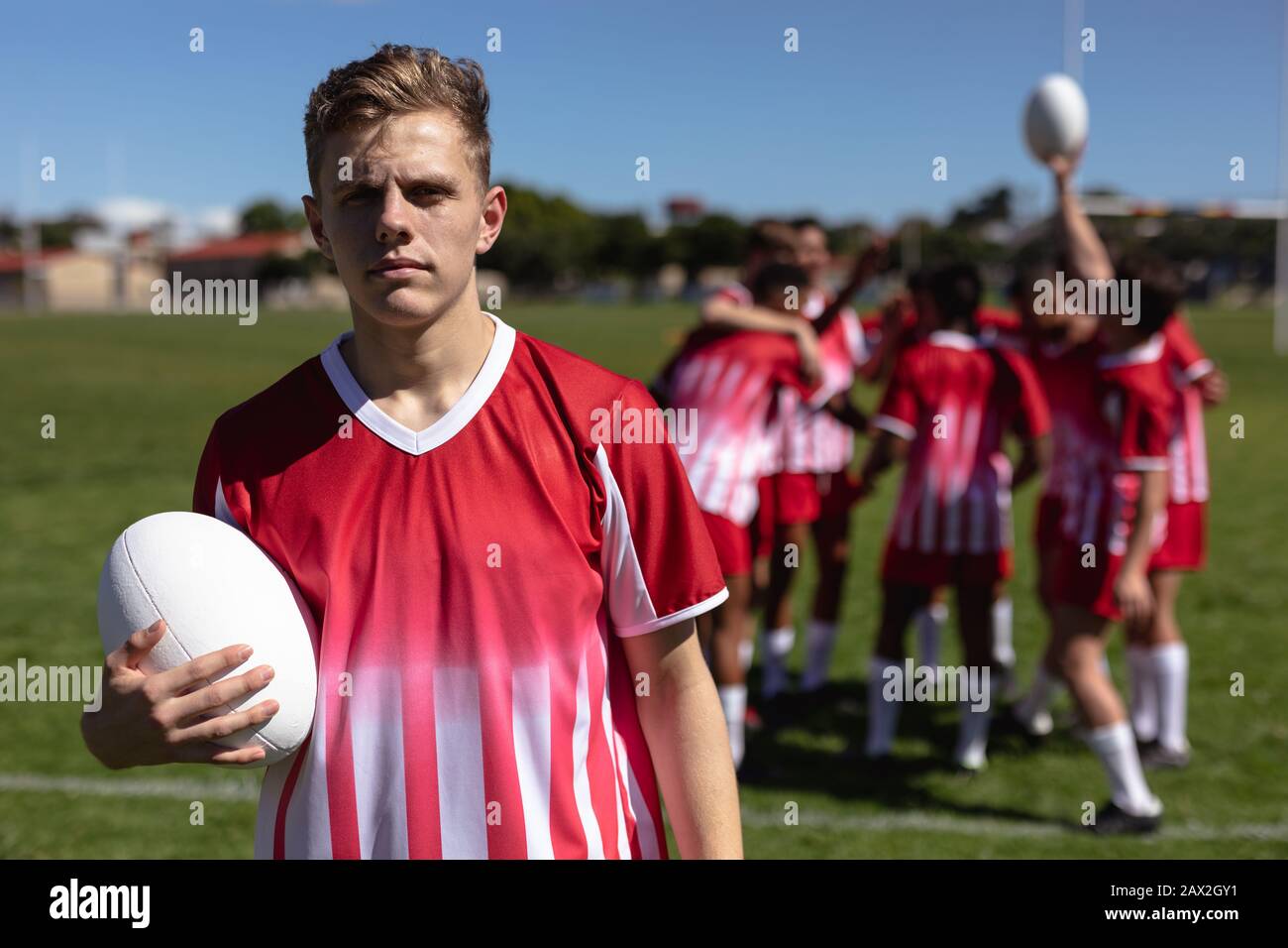 Boy holding rugby ball hires stock photography and images Alamy