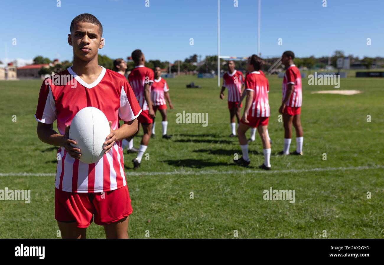 Boy holding rugby ball hires stock photography and images Alamy