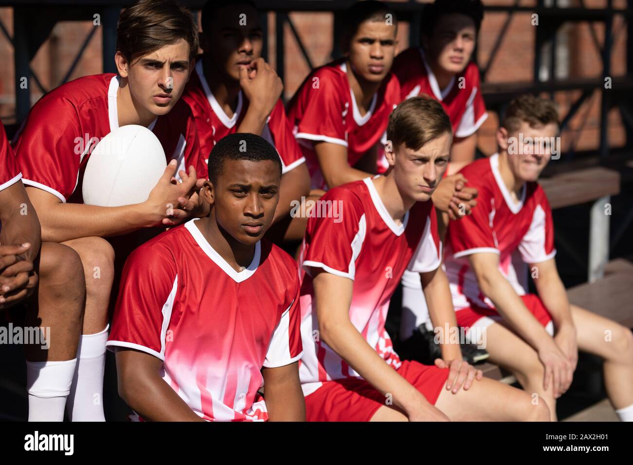 Rugby team on the benches Stock Photo