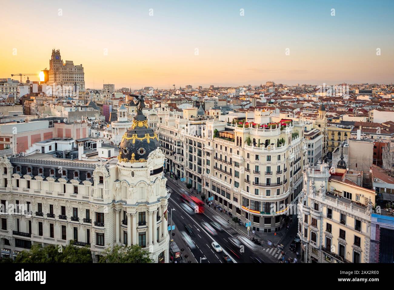 Landmark buildings on Gran Via street at sunset in Central Madrid, the capital and largest city in Spain. Stock Photo