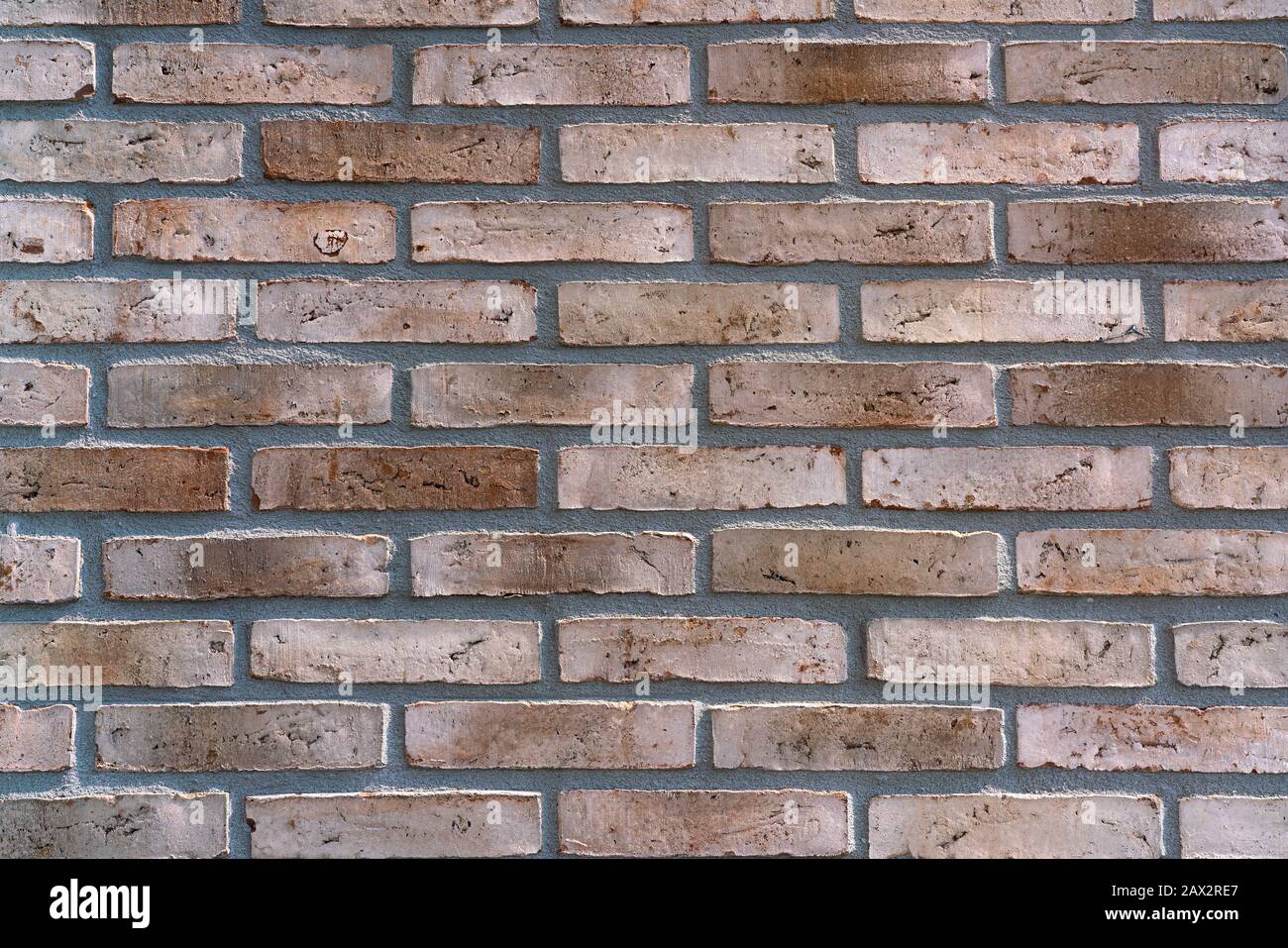 New brown-patterned brick facade. Background Stock Photo