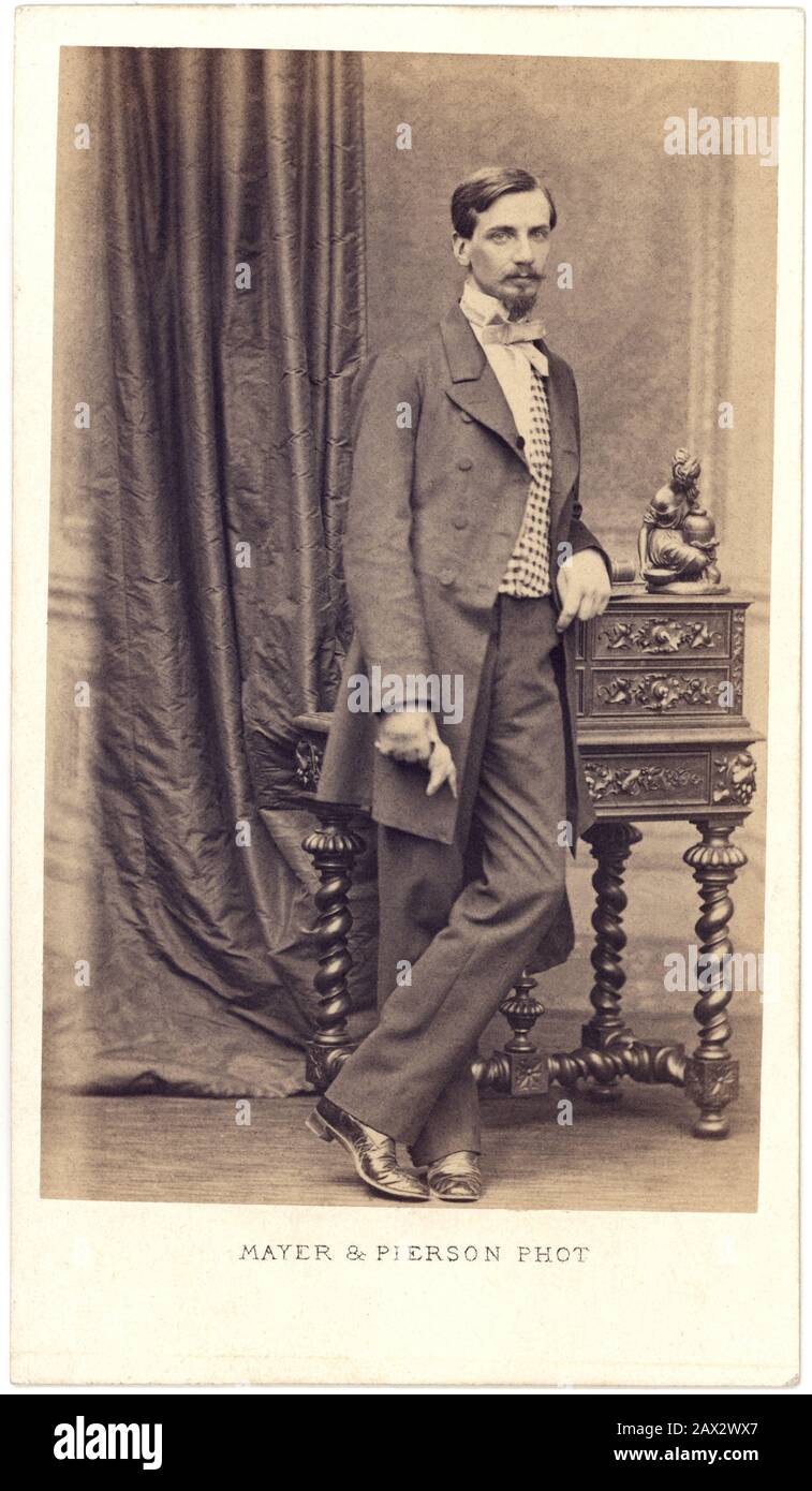 1875 ca ,  PARIS , FRANCE : A young handsome man with moustache and beard , Photo by MAYER and PIERSON , Paris  - 800's - '800 - XIX CENTURY - portrait - ritratto - UOMO - baffi  - collar - colletto - tie - cravatta - bow - papillon - fiocco - MODA MASCHILE - FASHION -  YOUNG - MEN - UOMINI  - IXI CENTURY -  800's - '800 - OTTOCENTO - FOTO STORICHE - HISTORY - gloves - guanti shoes - scarpe - gilet - panciotto   ----  Archivio GBB Stock Photo