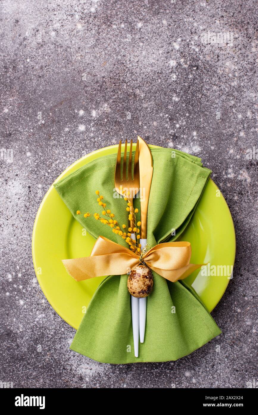 Easter table setting with green plate Stock Photo
