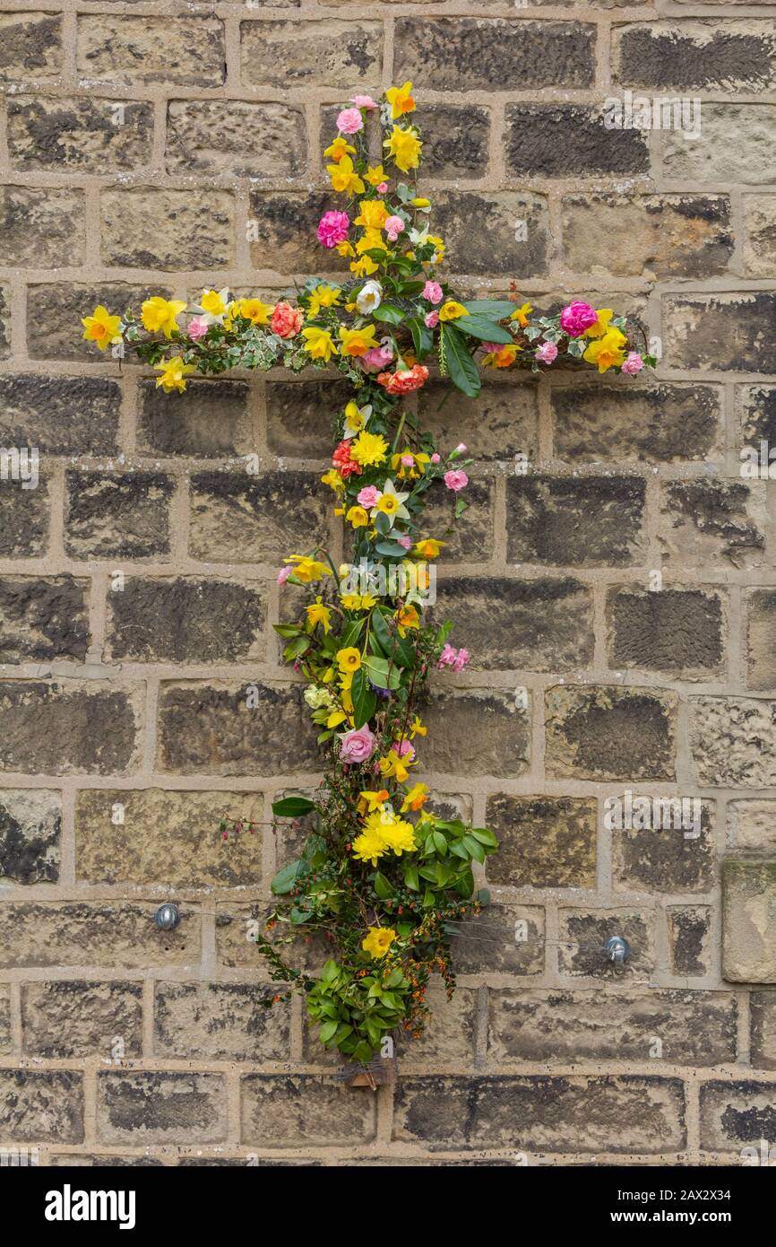 A floral Christian cross outside Baildon Methodist Church in Yorkshire, England. Stock Photo