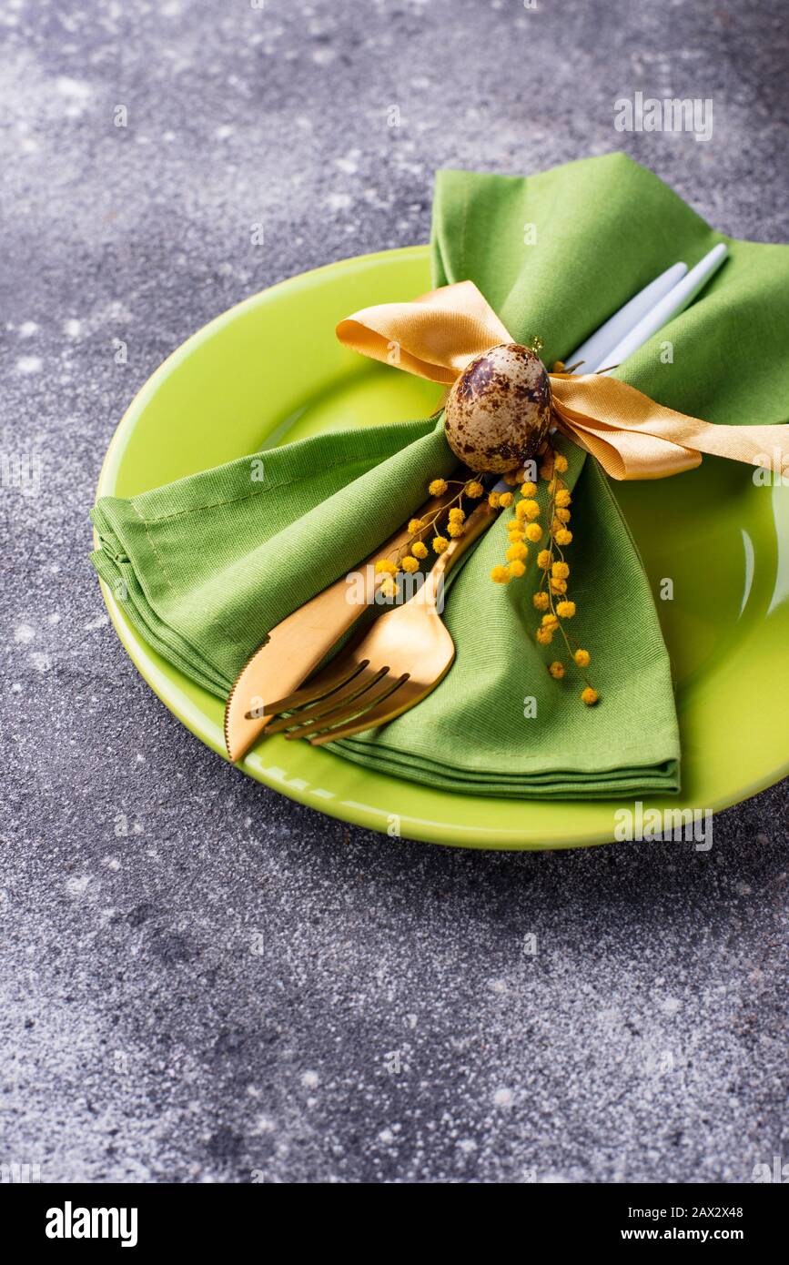 Easter table setting with green plate Stock Photo