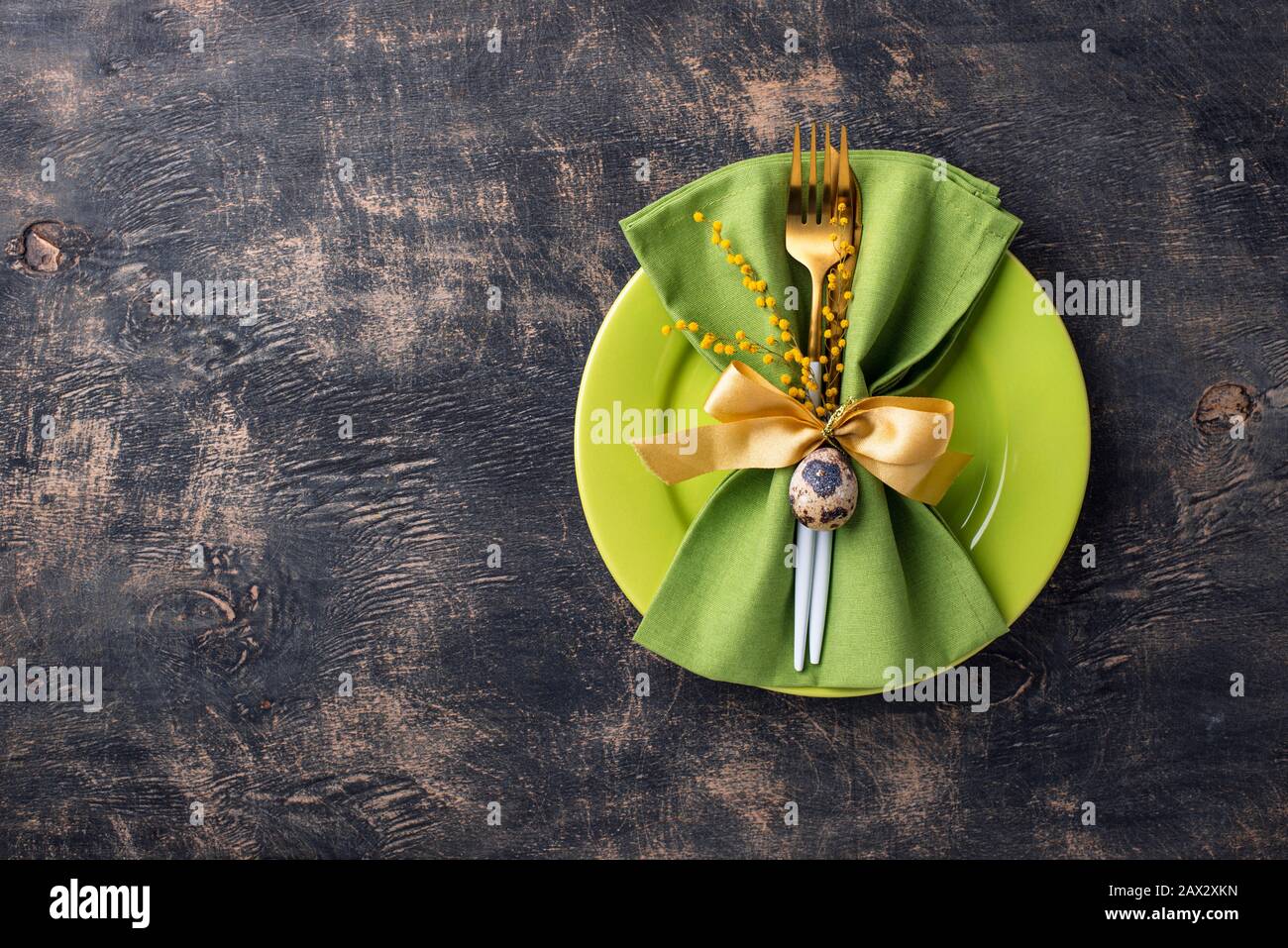 Easter table setting with green plate Stock Photo