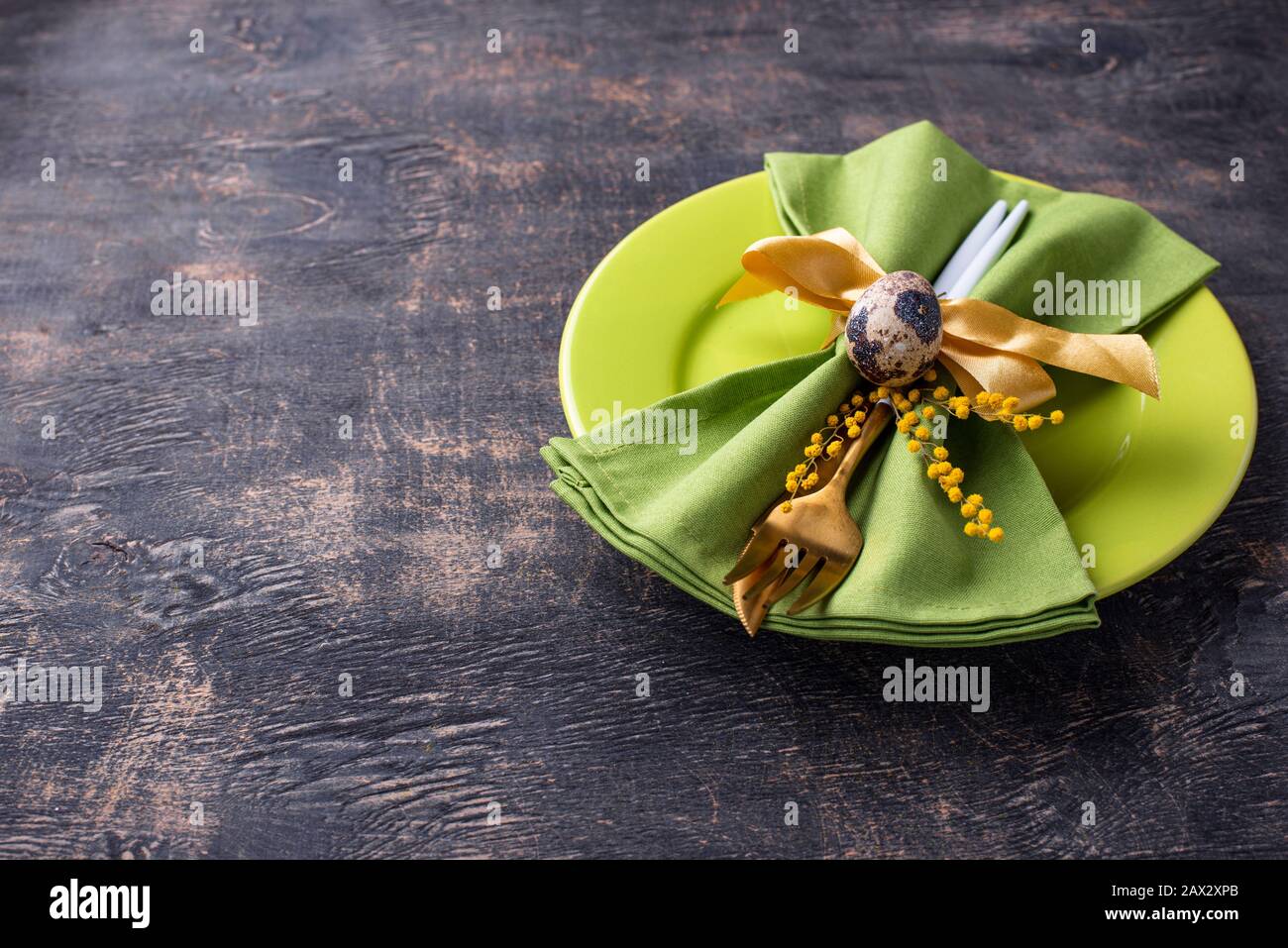Easter table setting with green plate Stock Photo