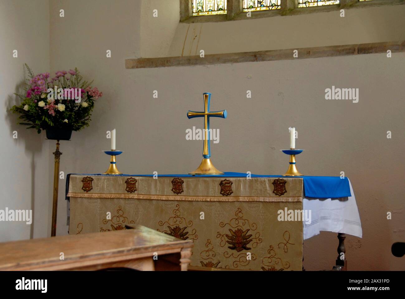 Cross and two candles on altar, St Pancras church, Widecome in the Moor, Devon, England Stock Photo
