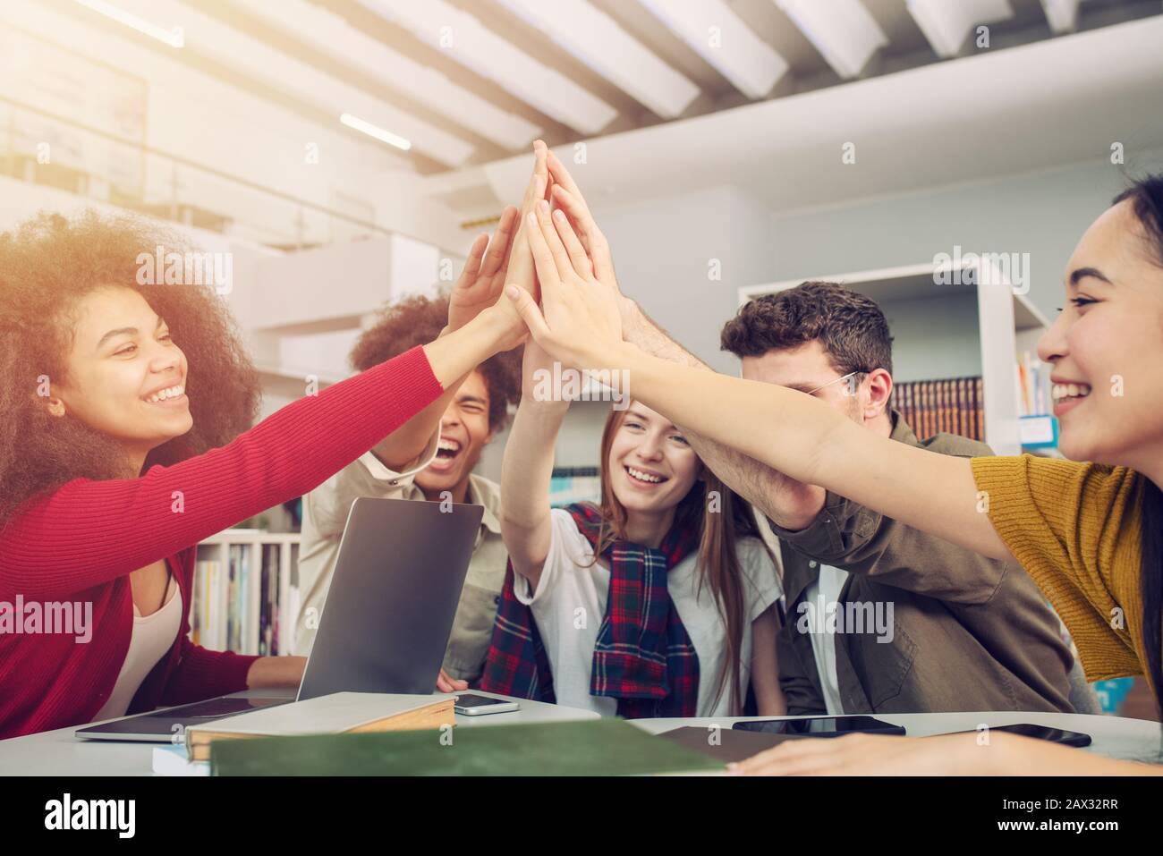 Students putting their hands together. Concept of teamwork and ...