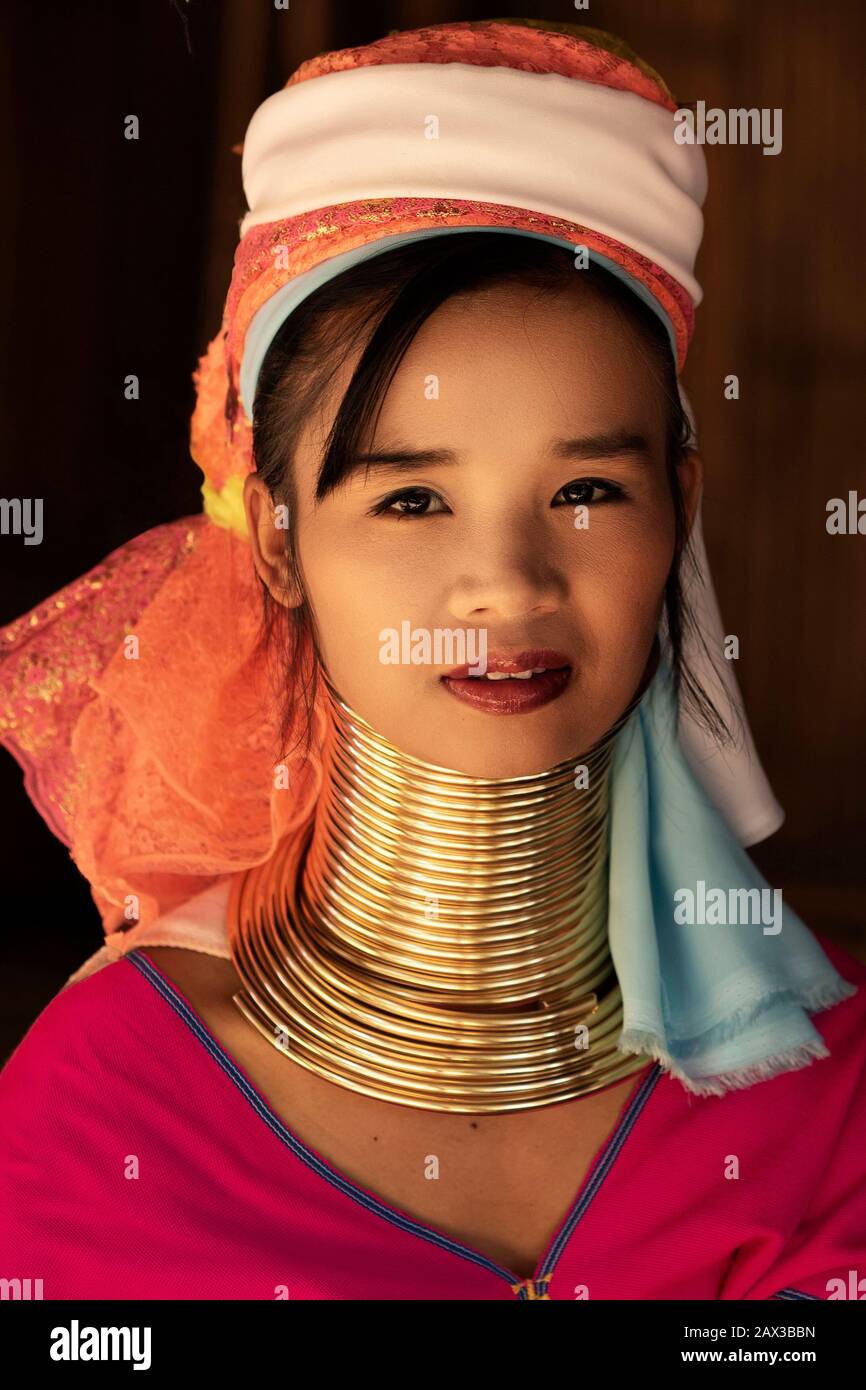 Chiang Rai Province, Thailand, portrait of young Karen Long Neck woman wearing traditional brass rings in hill tribe village near Chiang Rai. Stock Photo