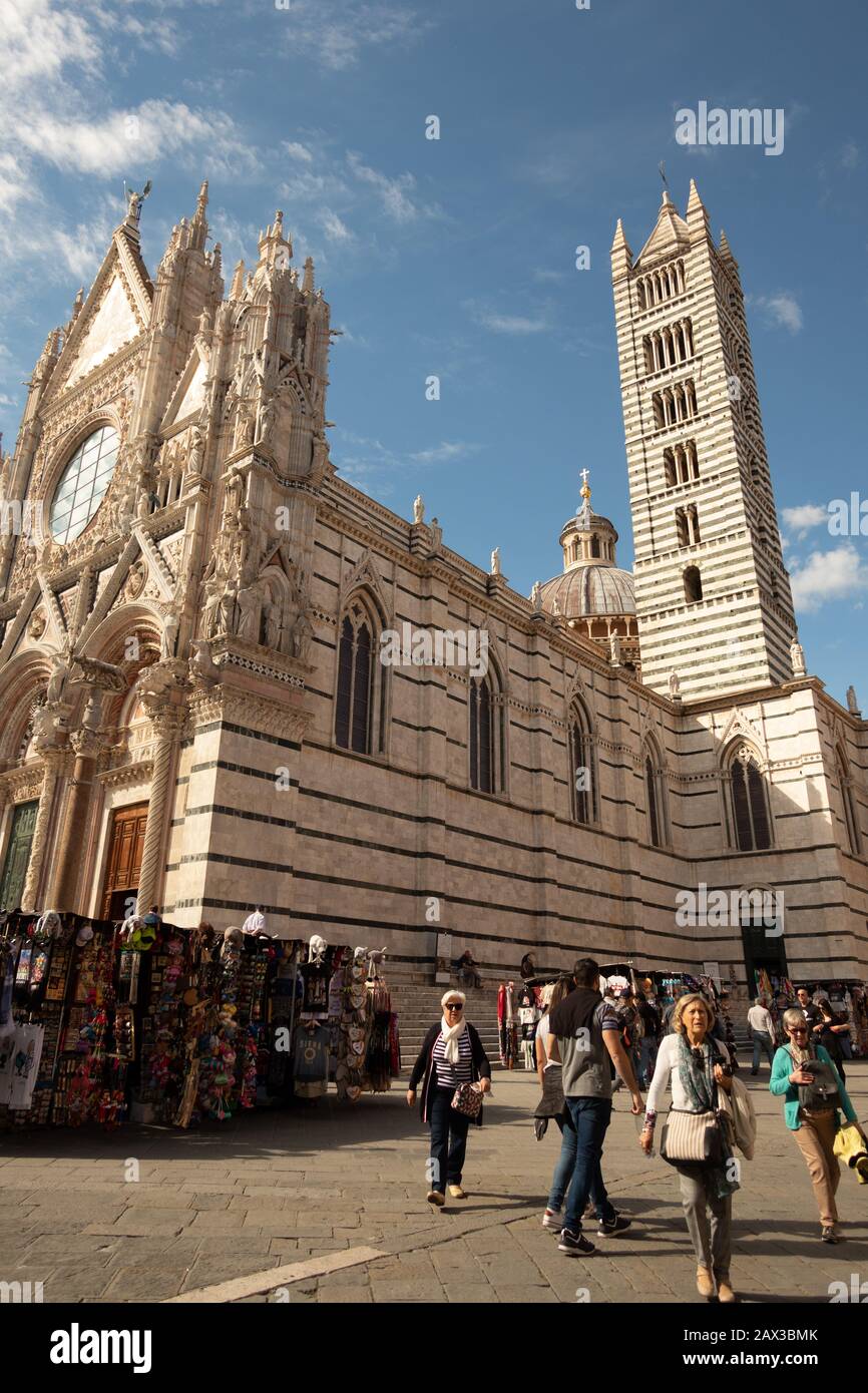 Romanesque-Gothic cathedral with mosaics 13th-century with its famous facade of black and white marble stripes Duomo di Siena Sienna Italy Stock Photo