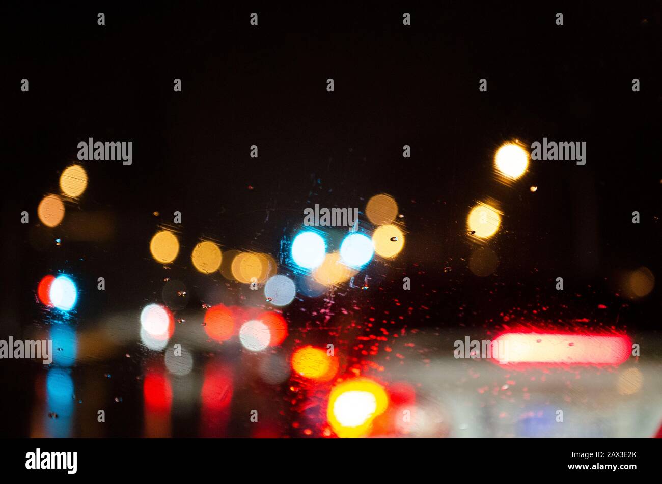 Defocused traffic car lights at night, bokeh style, abstract style background, city lights with dark background. Stock Photo