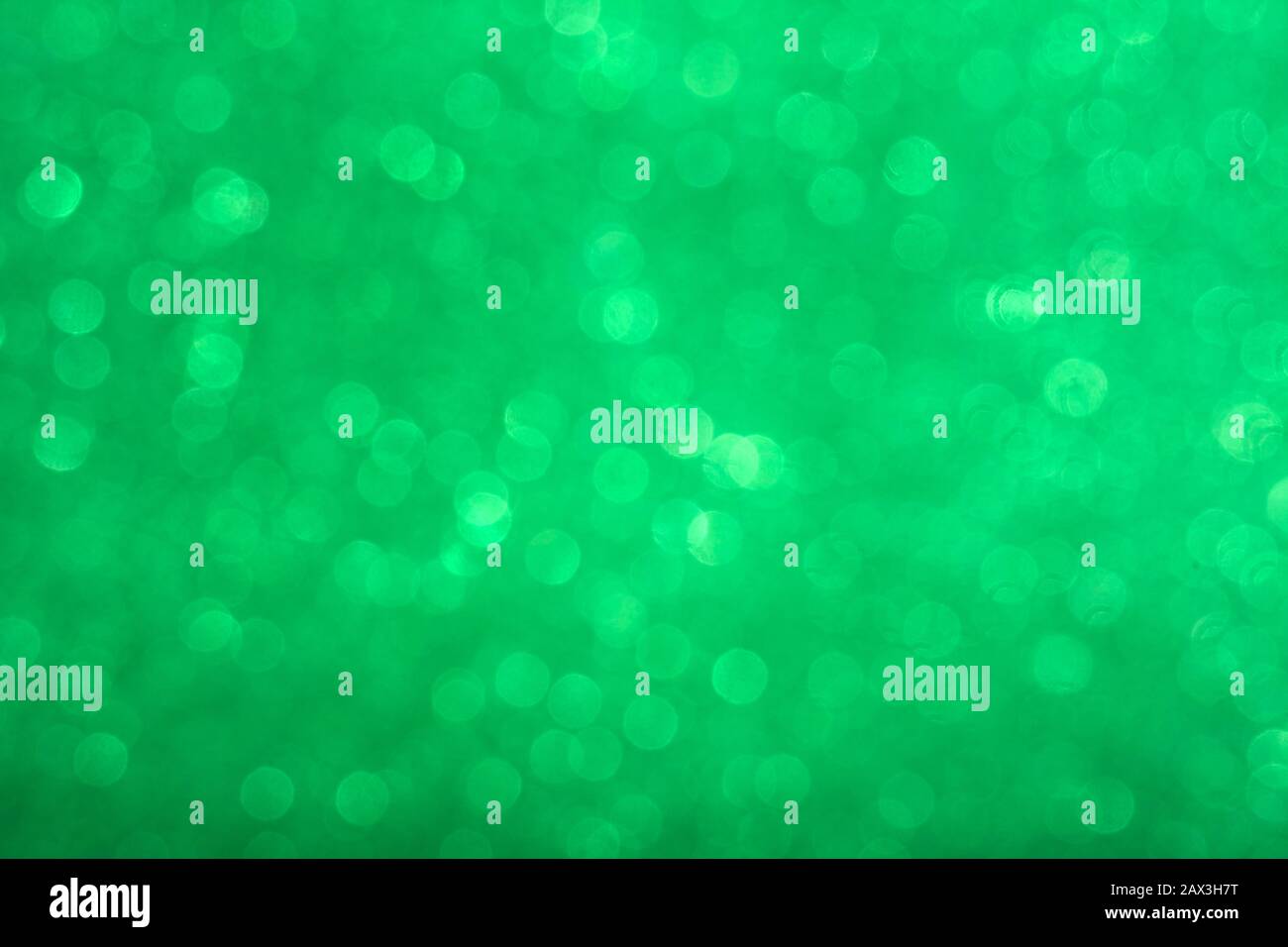 Abstract shiny circular green bokeh background. Spring Stock Photo