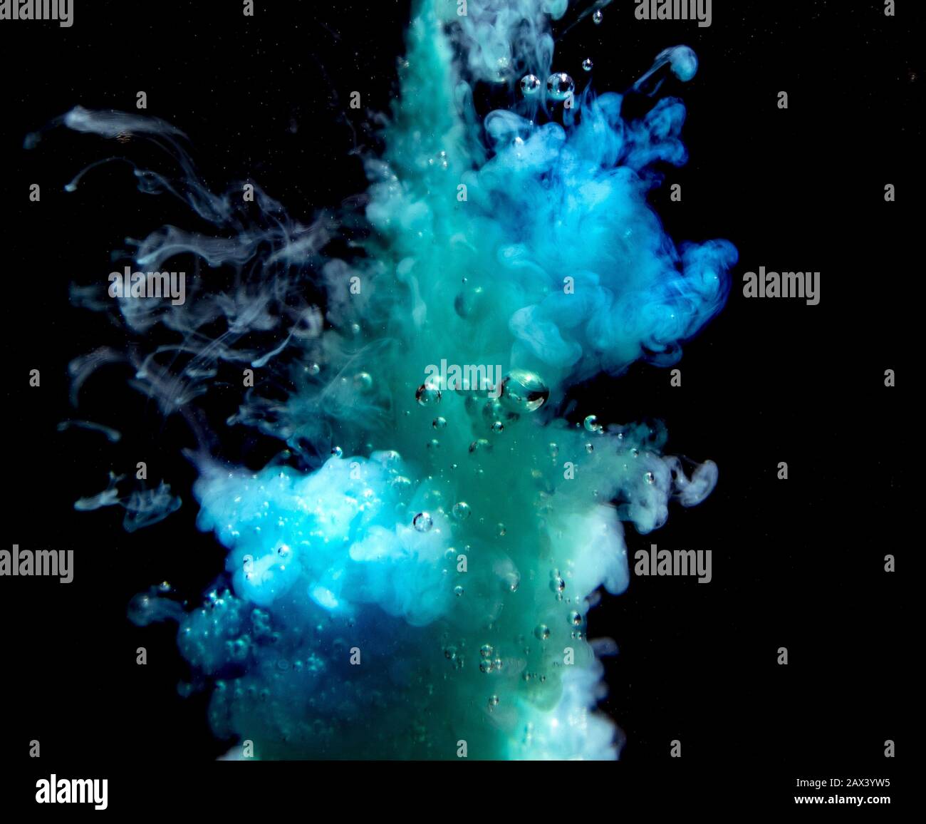 Abstract concept of teal color ink drop plume in water on an isolated ...