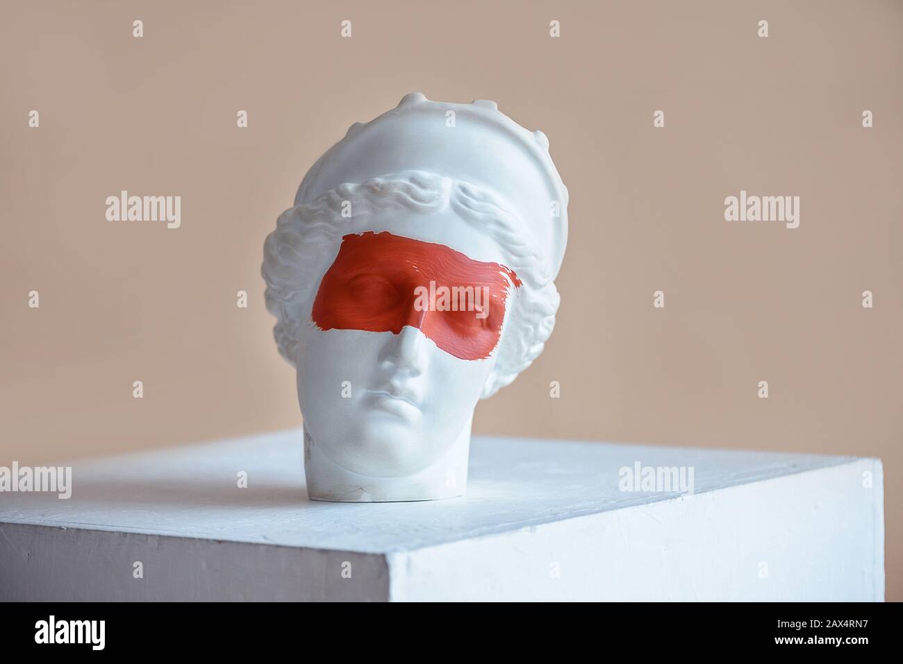 Plaster bust with red strip on the eyes Stock Photo