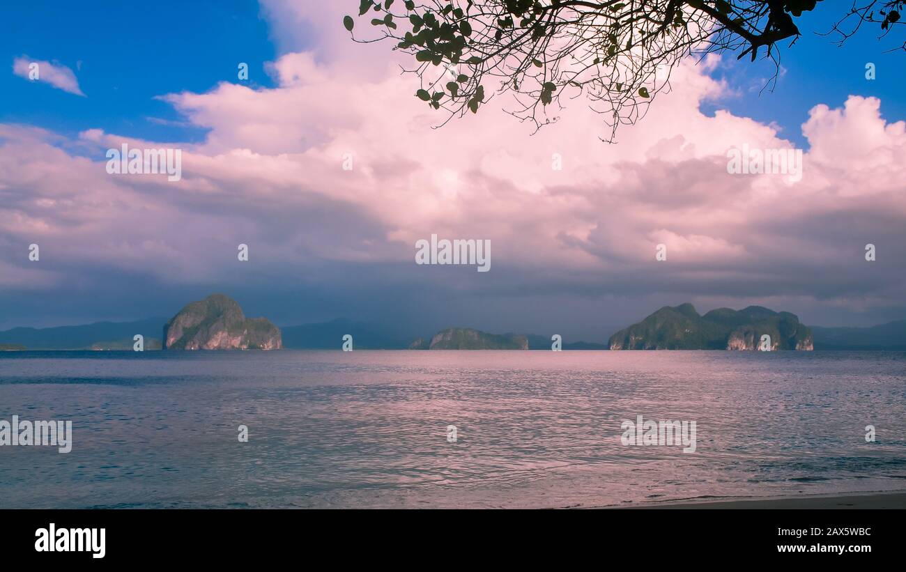 Limestone islets under afternoon cloud formation - El Nido, Palawan, Philippines Stock Photo