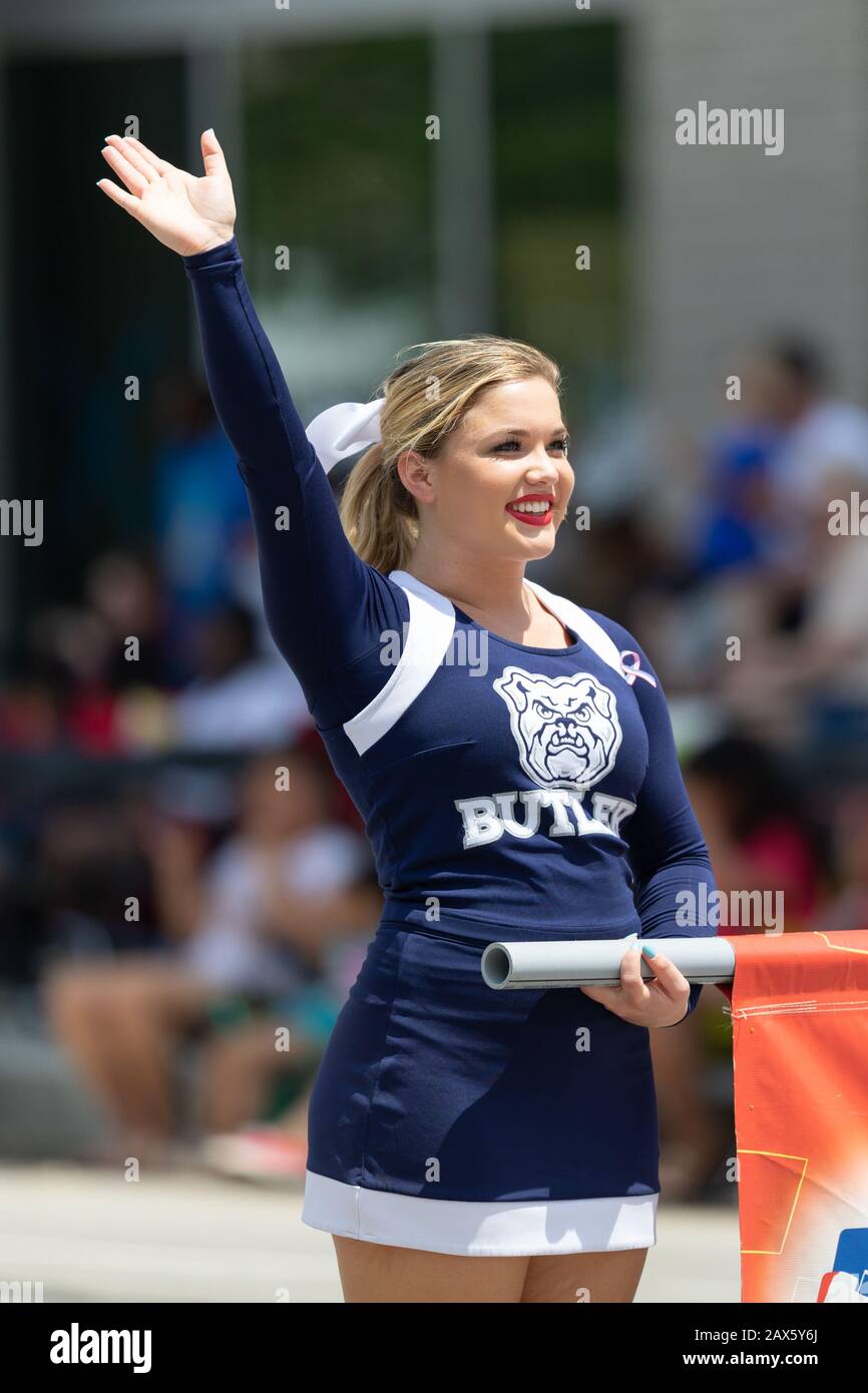 Indianapolis, Indiana, USA - May 25, 2019: Indy 500 Parade, Lady from the Butler University waving and smiling at the spectators during the parade Stock Photo