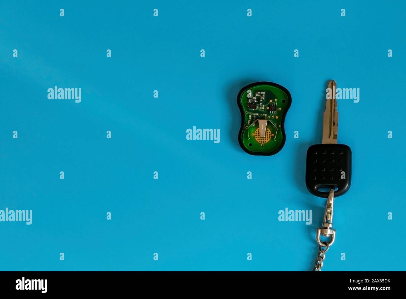 Car key with remote control. Alarm for cars. Broken old, circuit, battery. Key repair. Stock Photo