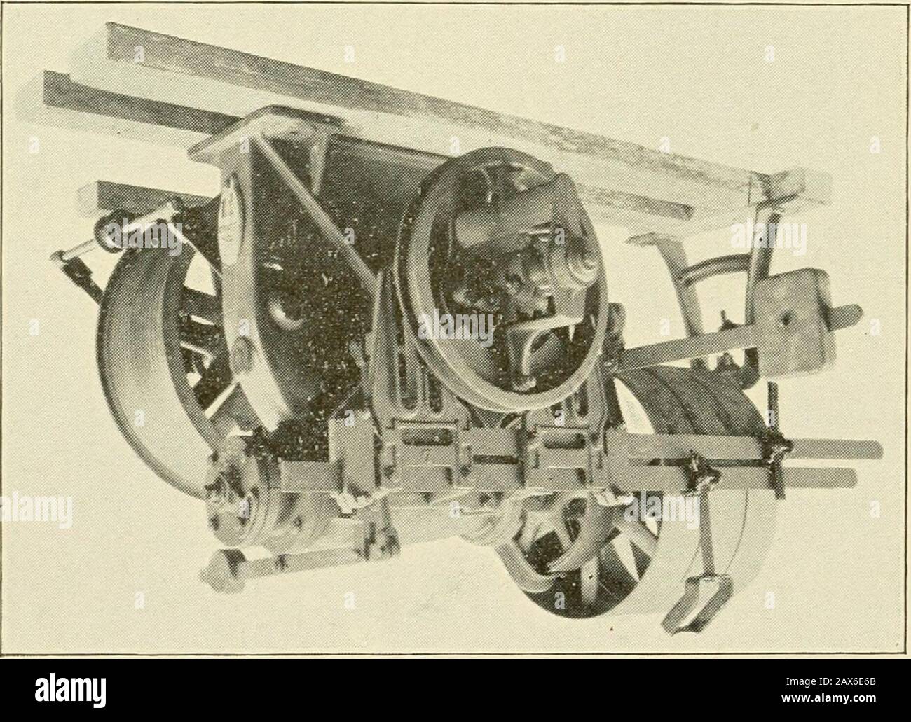 Useful information for cotton manufacturers . YS ELEVATORS.Belt Power Machines. The Improved Hindley Worm and Gear is used on all beltpower machines of this make. As these are the main feattiresof the hoist, special attention is paid to them. The shape of this worm and gear is f shown in the marginal cut. The wormis cut from a solid blank, curved to cor-respond to the arc of the wheel, so thatthere is a variation of pitch from point toroot of tooth. This variation of distancefrom center to center of teeth in the wormexactly corresponds to the two diametersof teeth of the wheel, thus giving a p Stock Photo