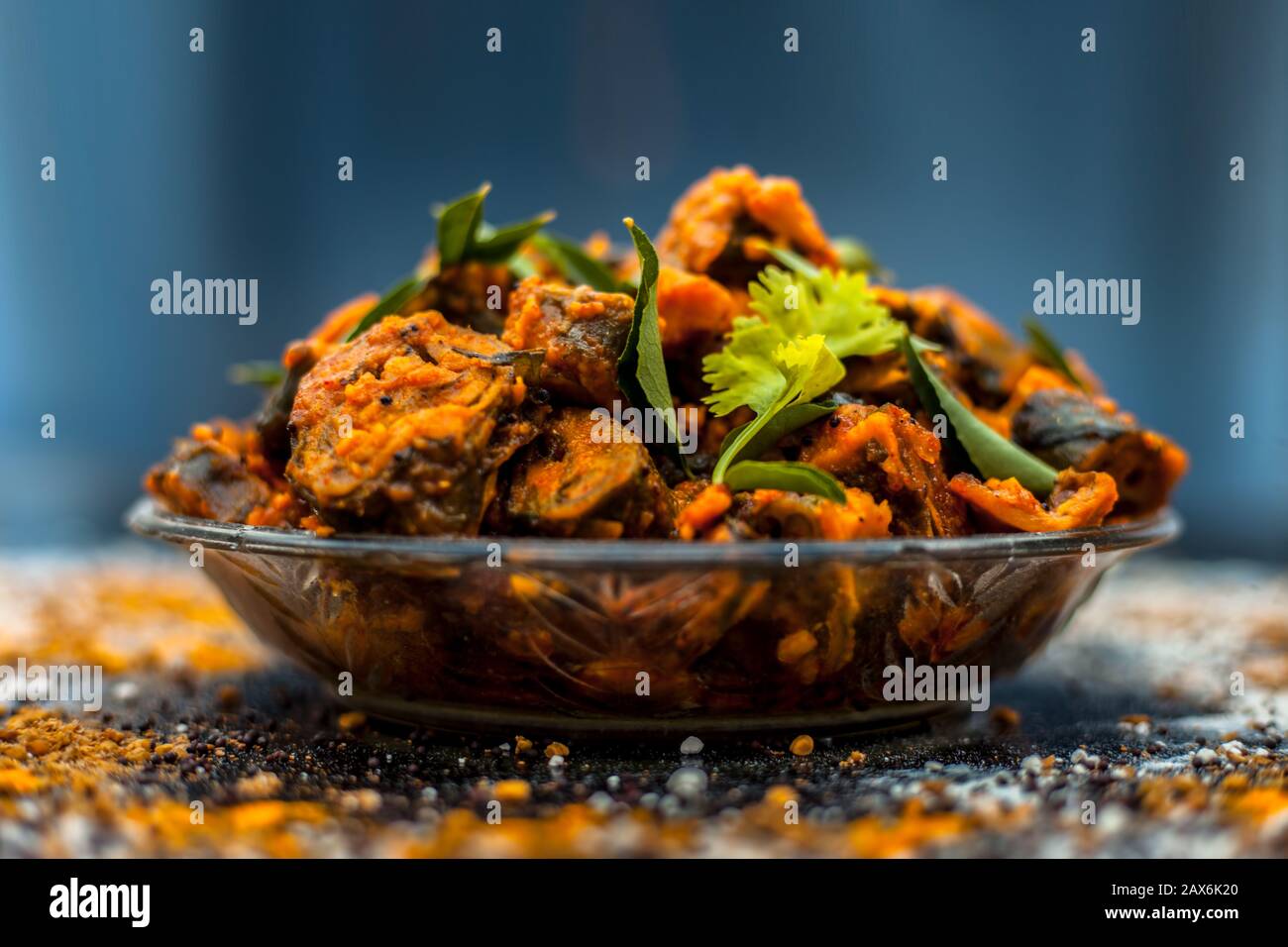 Famous Indian & Gujarati snack dish in a glass plate on wooden surface