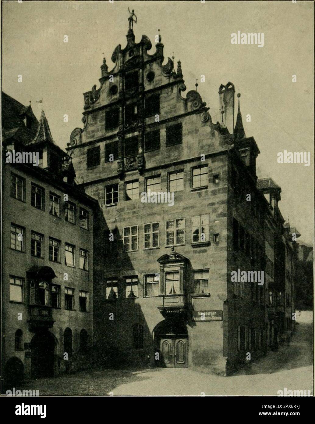 Nuremberg and its art to the end of the 18th century. . Fig. 114. Faijade on the court of no. 34, Karolinenstrasse.Photograph by F. Schmidt. the dates 1578 and 1596. Painting had an important part in its decoration,both inside and outside. Towards the end of the 16 century, the gable,—just seen to have beenso richly adorned in the Peller House (of 1605),—had again been generallyadopted as a decorative architectural feature. Either it was, as in the Peller GABLES. i6i House, erected in front of a sloping roof, or houses again turned their gableends to the streets. The latter was the case with t Stock Photo