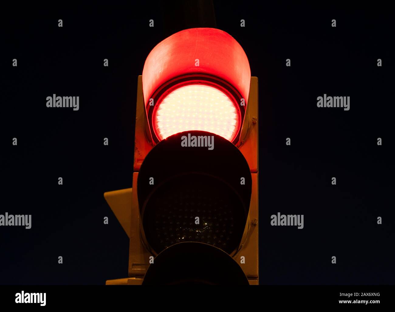 Red light on a traffic light at the street at night Stock Photo Alamy