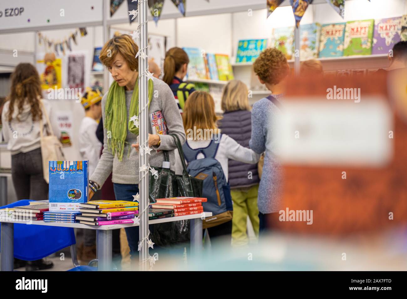 Katowice, Poland - December 6-8, 2019: woman looking for books during Silesian Book Fair in Katowice in 2019 at International Congress Centre. Stock Photo