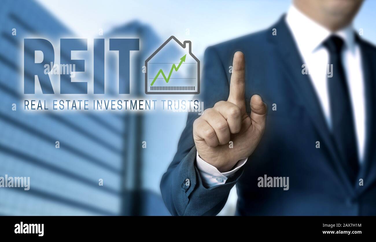 REIT concept is shown by businessman. Stock Photo