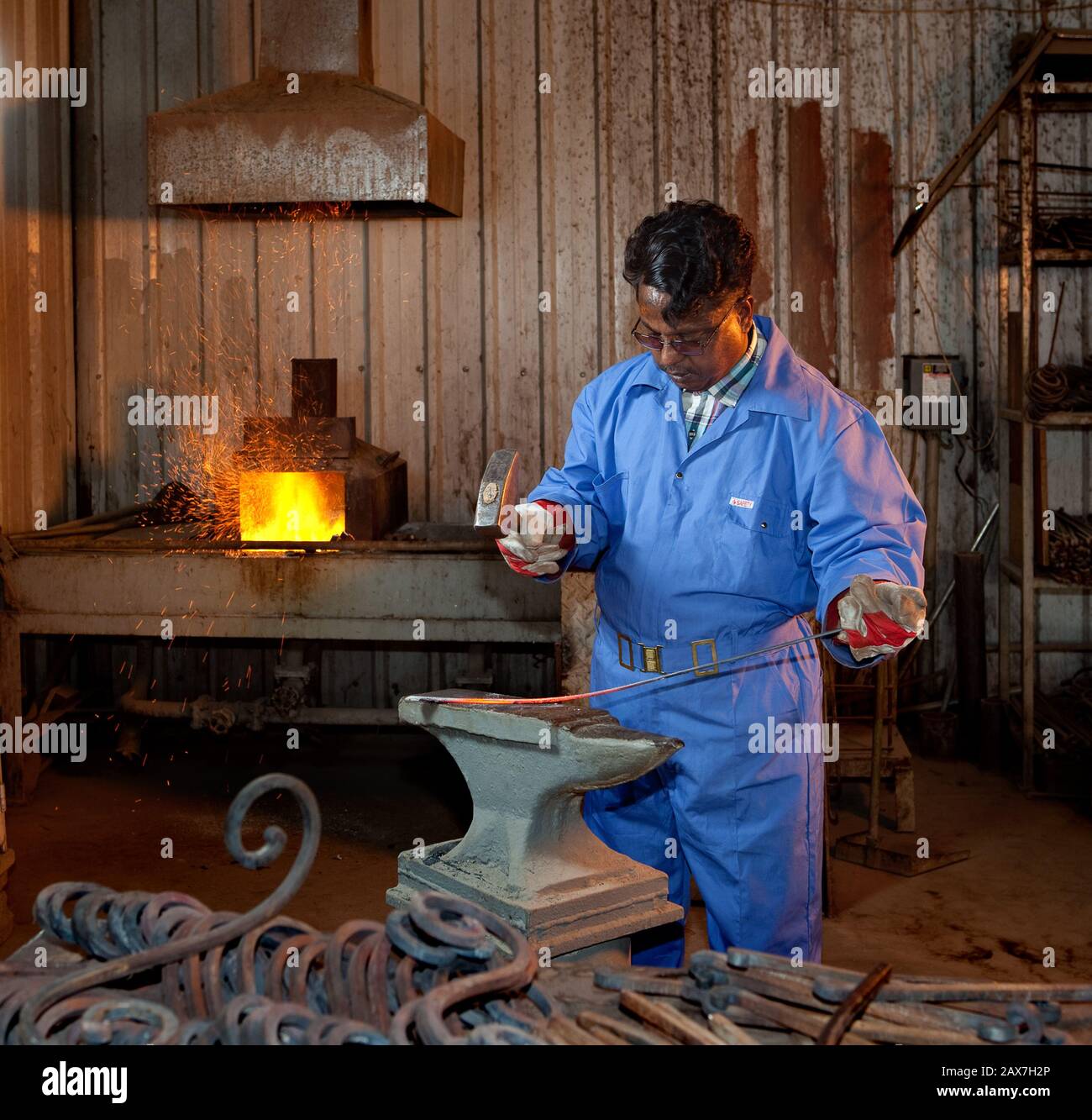 Indian worker in a steel workshop in Dammam, Saudi Arabia. Stock Photo