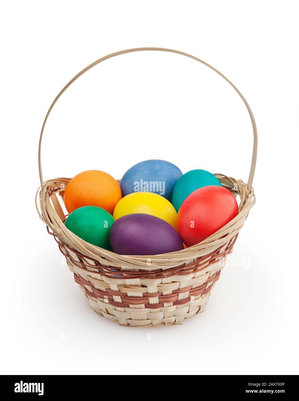 Colorful easter eggs in basket isolated on white background with ...