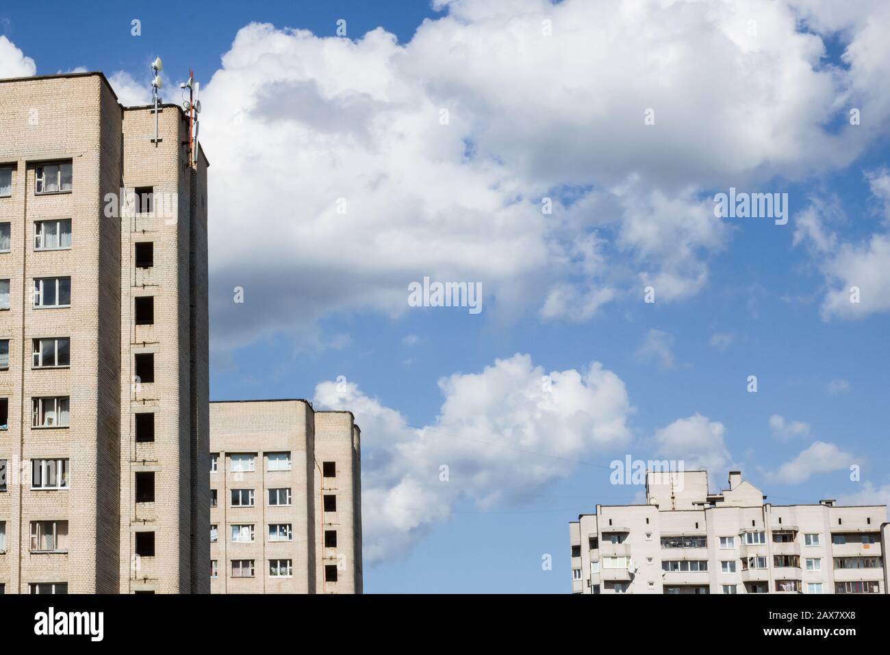 High houses against the blue sky and clouds, background for text Stock ...