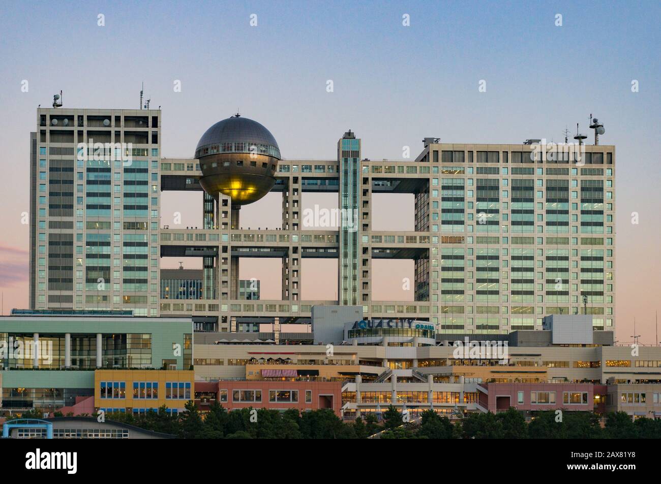 Tokyo, Japan - August 31, 2016: Fuji TV building and Aqua city shopping mall in Minato district on Odaiba island at sunset Stock Photo