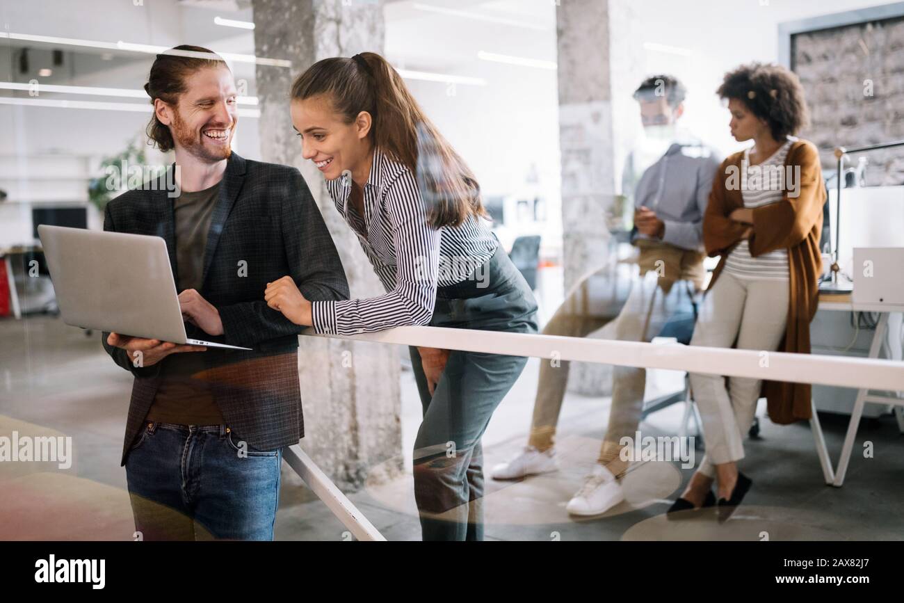 Programmers cooperating brainstorming at information technology company ...