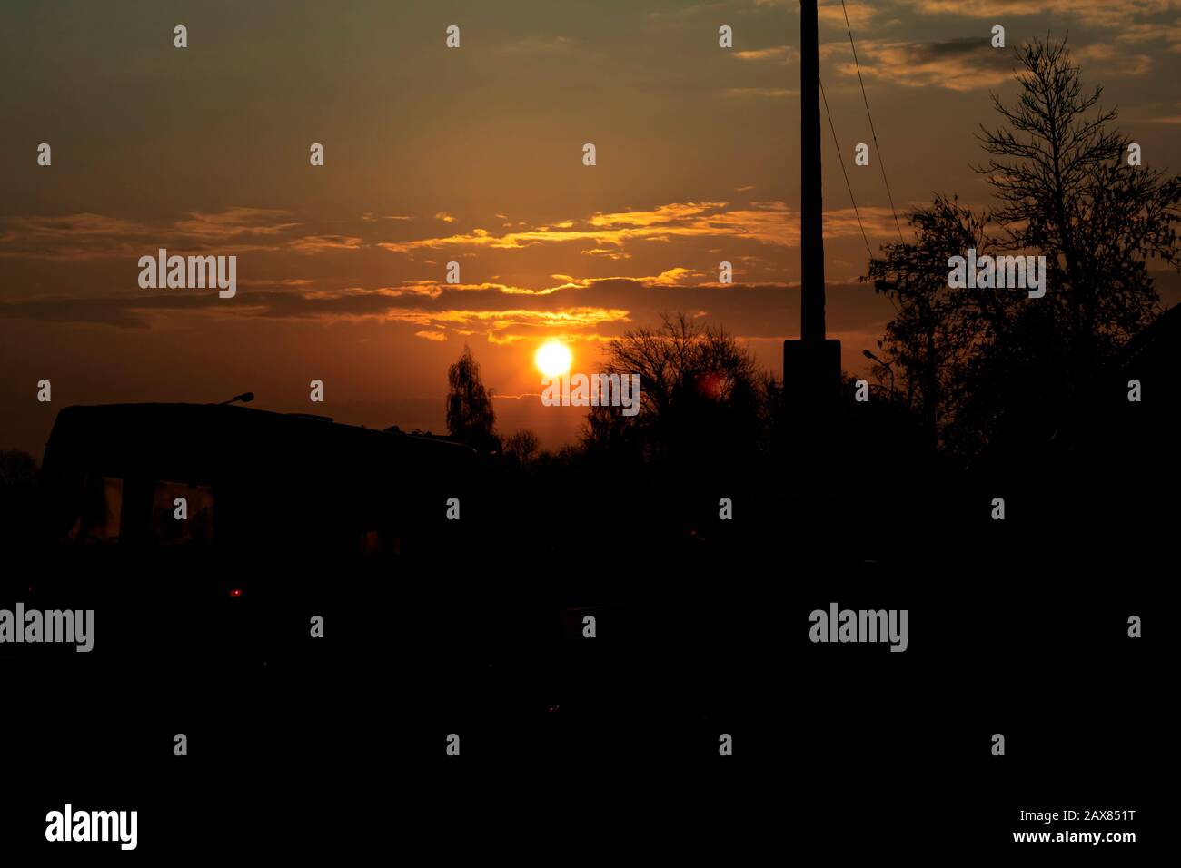 Sun in the red sky at sunrise Stock Photo - Alamy