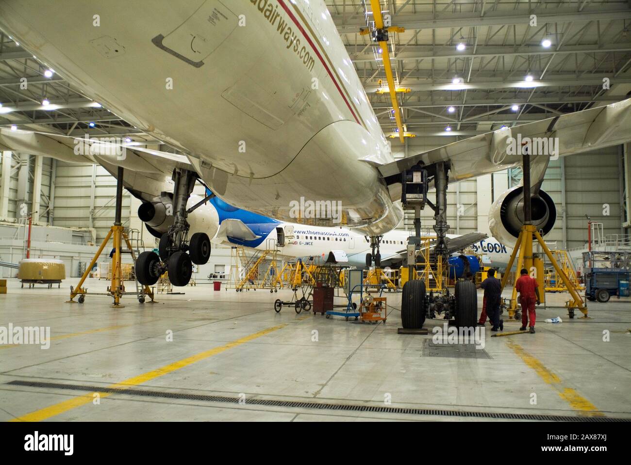 Aircraft on jacks while getting its undercarriage serviced at Abu Dhabi Airport, Abu Dhabi, UAE. Stock Photo