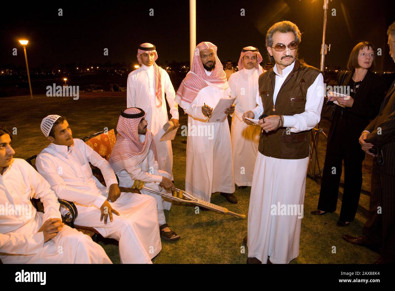 His Royal Highness Prince Al Waleed Bin Talal Al-Saud giving a helping hand to special needs Saudi Nationals gathered at the Kingdom Resort, Riyadh, Saudi Arabia. Stock Photo