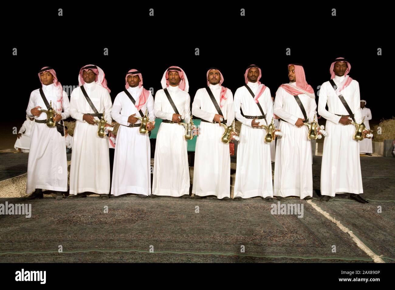 Tea boys stand ready with tea to serve His Royal Highness Prince Al