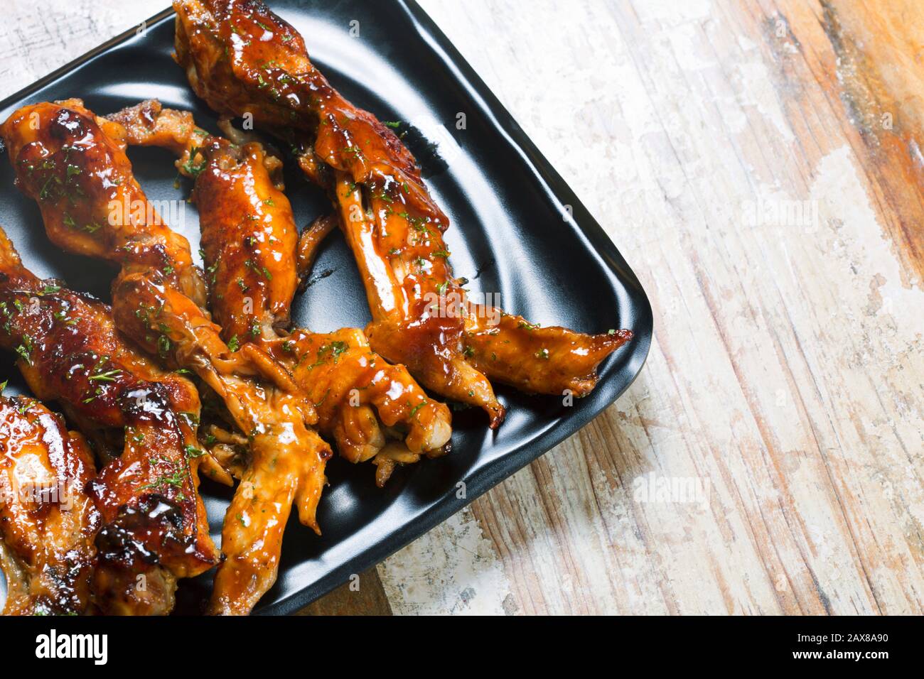 Glazed honey garlic chicken wings Stock Photo Alamy