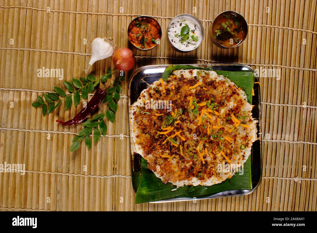 Onion uthappam with sambar and coconut chutney. South Indian Vegetarian