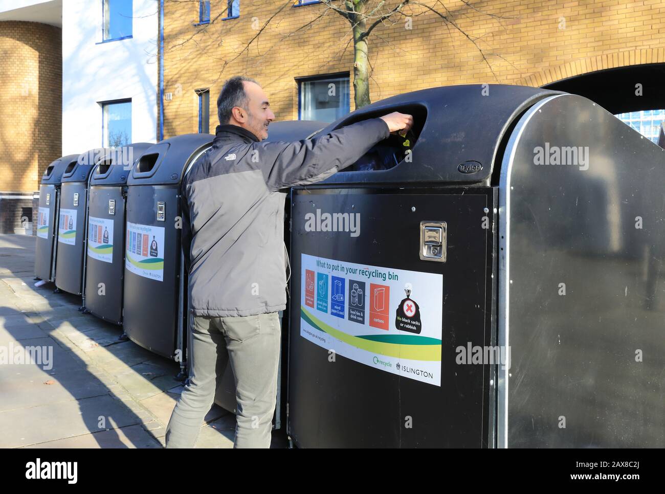 Using the recycling bins on the Cally in Islington, north London, UK Stock Photo Alamy