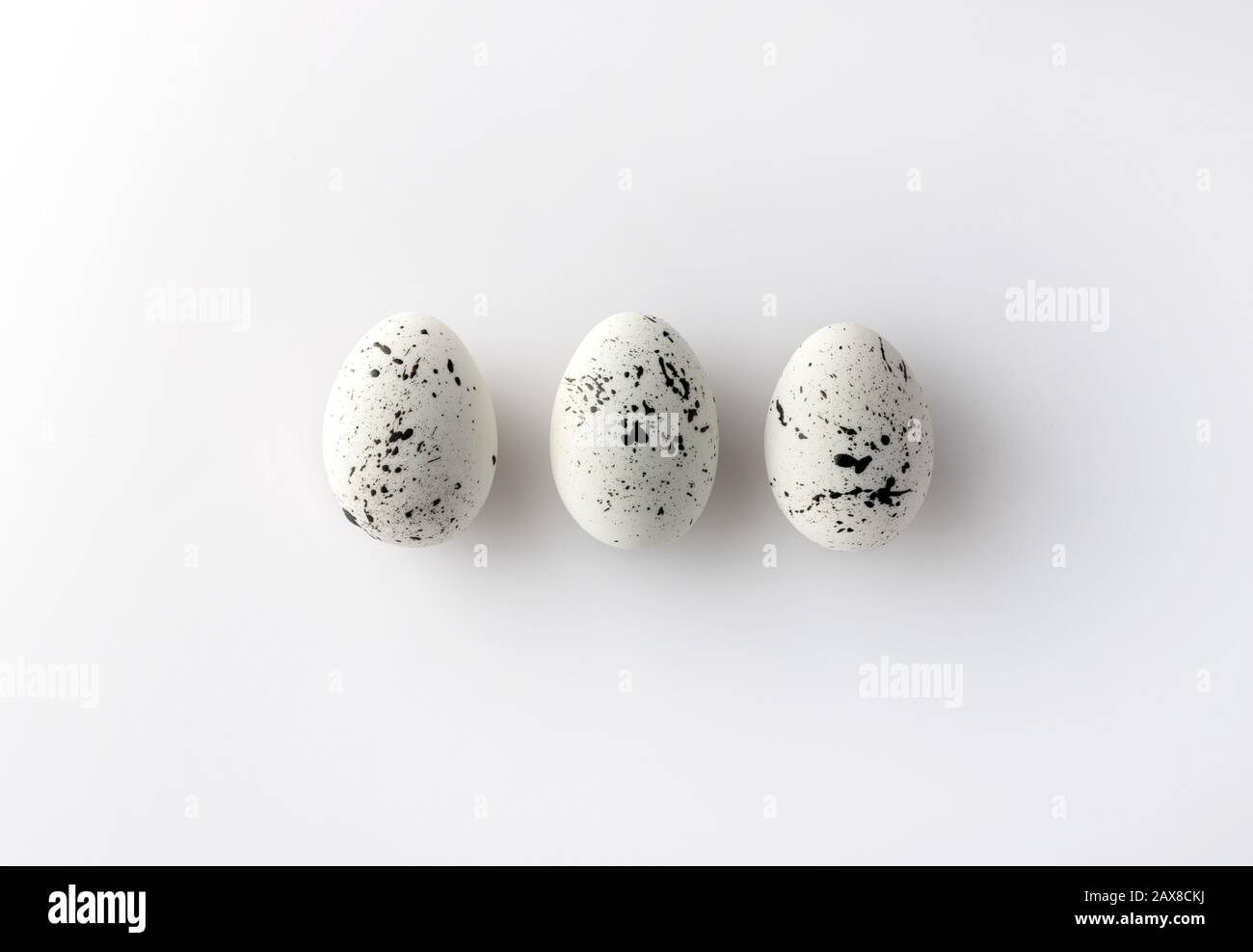 Creative Easter layout made of painted eggs on white background Stock Photo