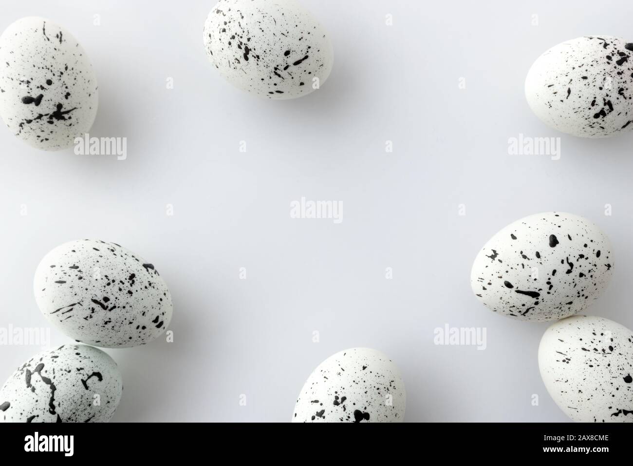 Creative Easter layout made of painted eggs on white background Stock Photo