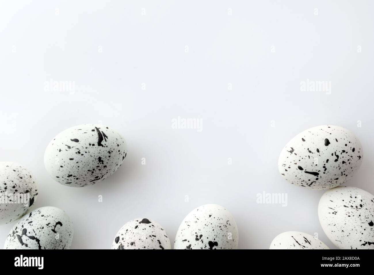 Creative Easter layout made of painted eggs on white background Stock Photo