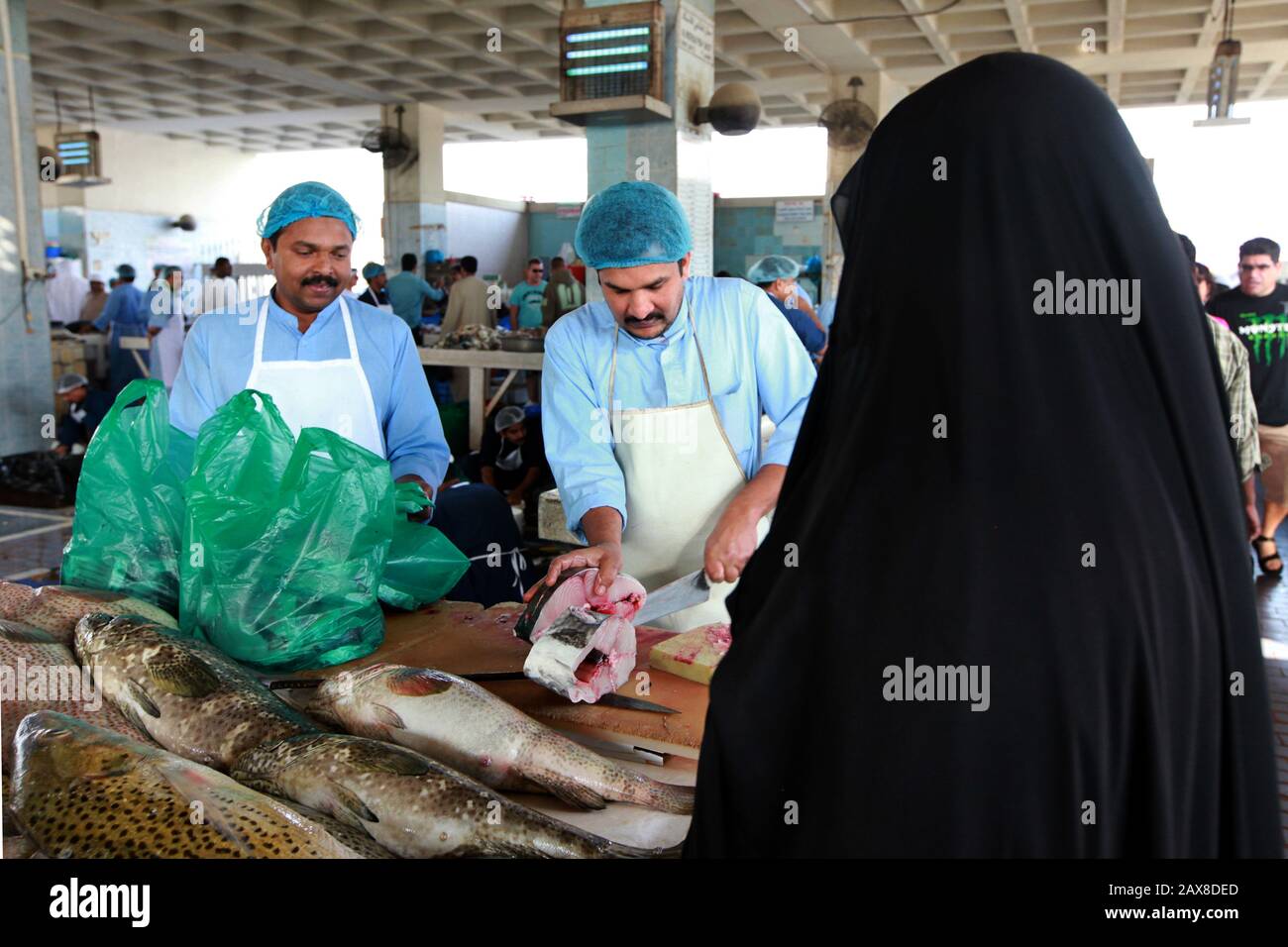 A woman shops at the Fujairah fish market. UAE. Stock Photo