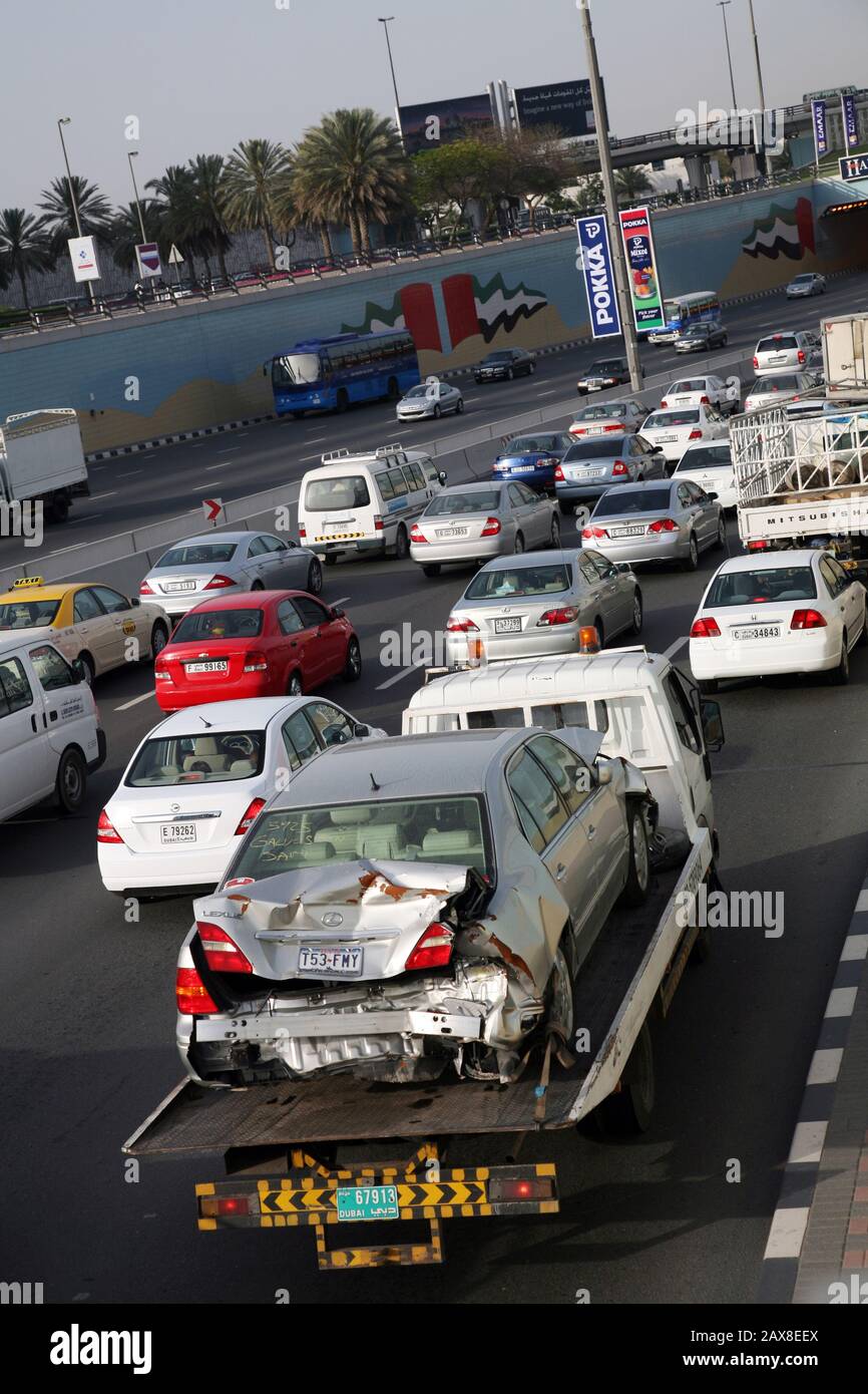 A wrecked car being towed away, Dubai, UAE Stock Photo Alamy