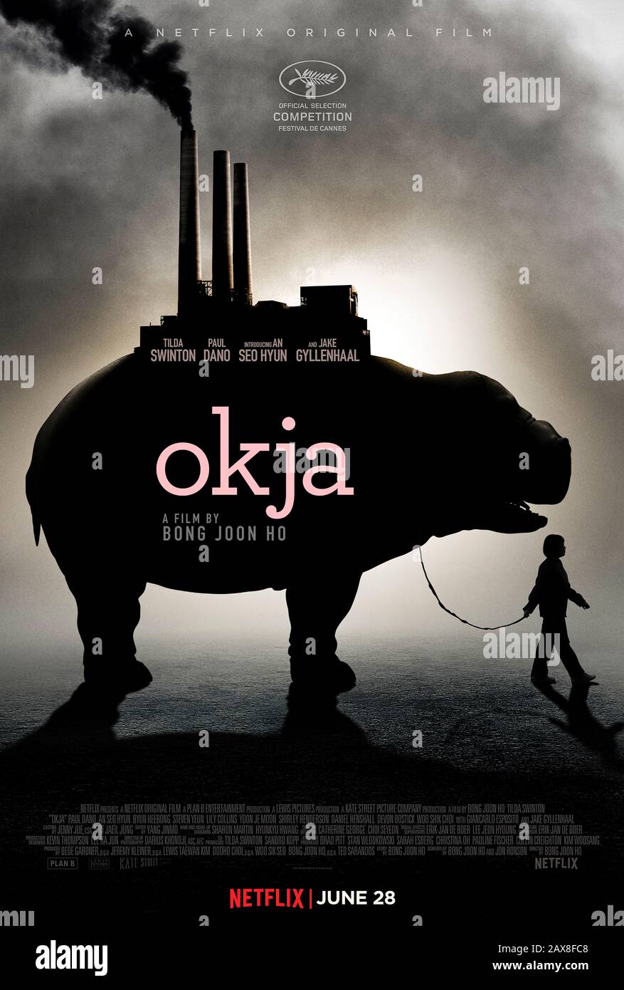 Okja (2017) directed by Bong Joon Ho and starring Tilda Swinton, An Seo Hyun, Paul Dano, Seo-hyun Ahn and Jeong-eun Lee. A young girl befriends a genetically modified superpig breed by the Mirando Corporation and fights to save its life. Stock Photo