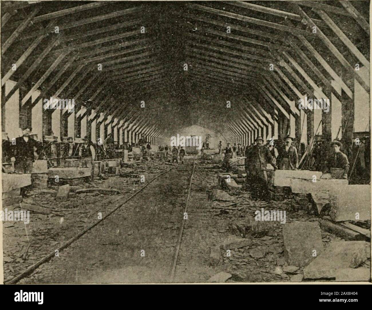 A text book of the geography, history, constitution and civil government of Vermont; also Constitution and civil government of the US., a publication expressly prepared to comply with Vermont's state school laws . Interior of a granite shed at Barre.. Granite shed at Hardwick; one of the largest in the world. Metals and Minerals 67 Slate.—The first slate quarry in Vermont was openedIn Guilford in 1812. Slate suitable for roofing, flooring,flagging and many other uses is found in three differentparts of the State, and the amount produced by Vermont isexcelled by no other State except Pennsylvan Stock Photo