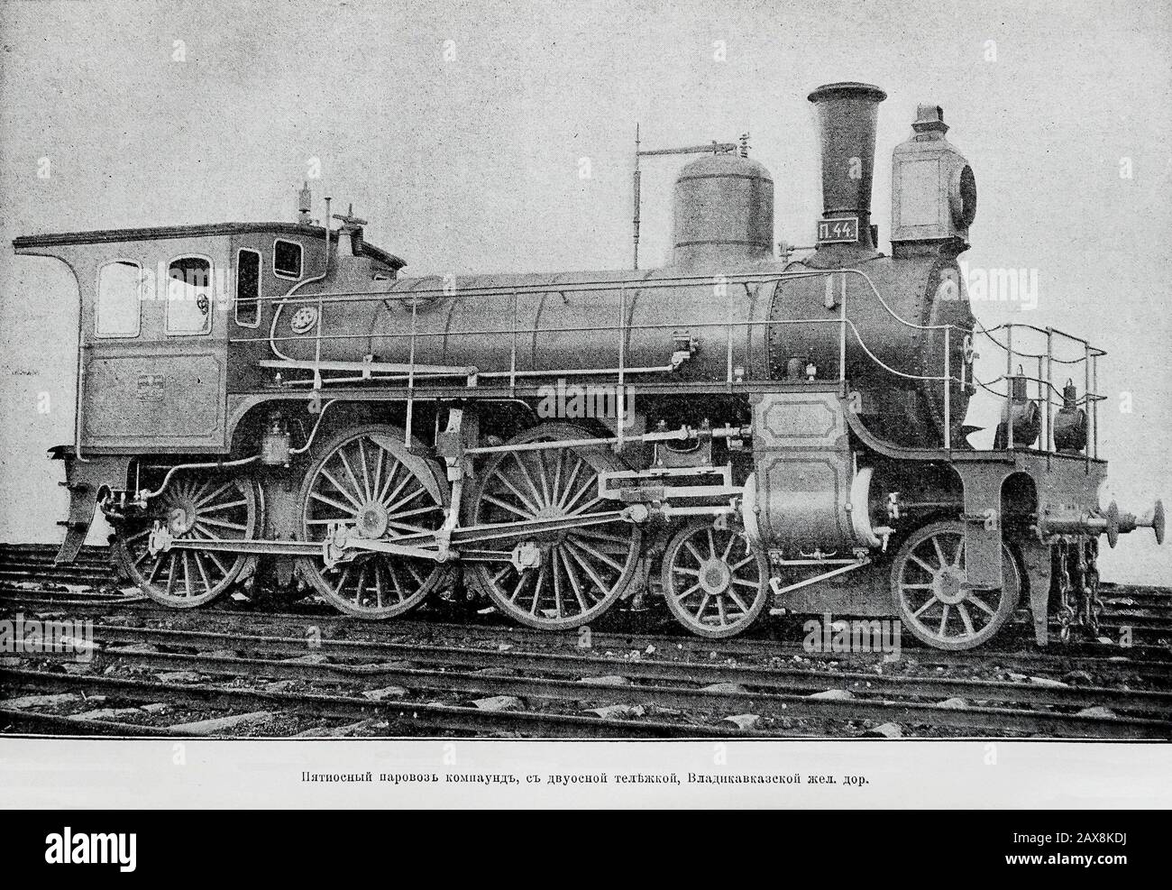 Five-axis steam locomotive with a biaxial truck of the Vladikavkaz railway. Engraving of the 19th century. Stock Photo