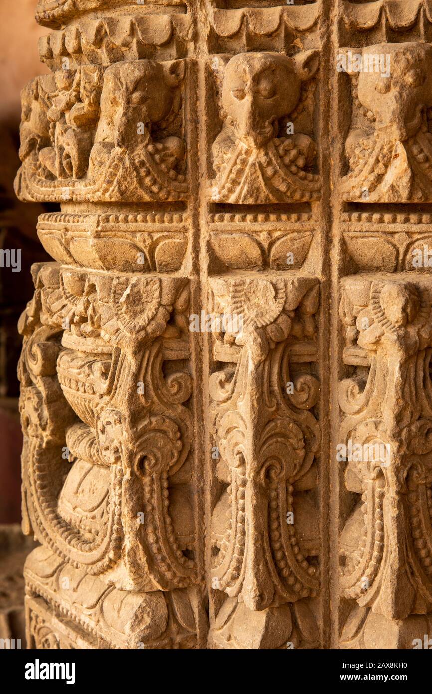 India, Rajasthan, Abhaneri, Chand Baori Stepwell, Mughal columned arcade, ancient carved stone pillar detail Stock Photo